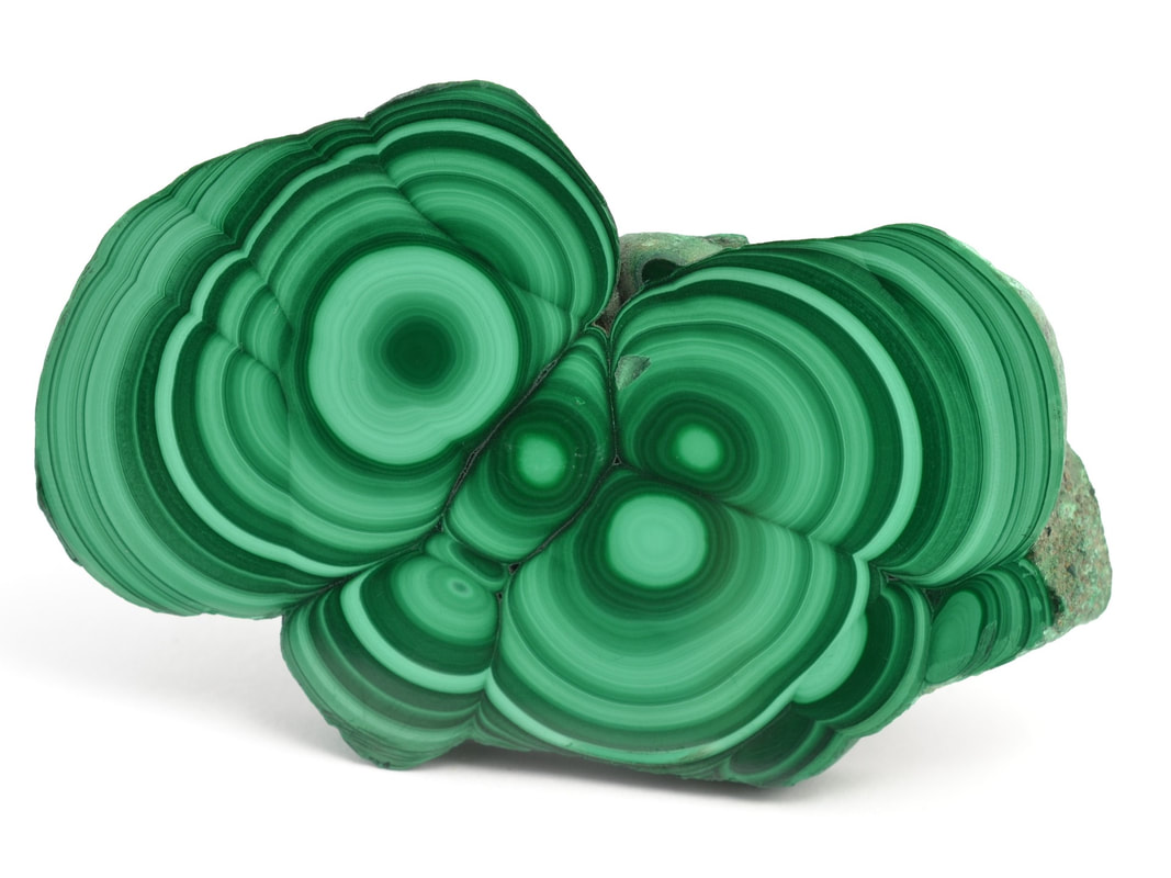 A slab of malachite displayed on its side